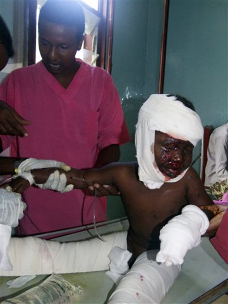 A nurse at Medina hospital in Mogadishu attends to a child who was wounded by mortar shell Monday.